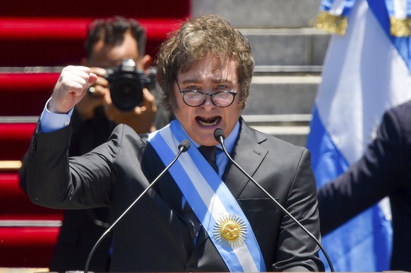 FILE- Argentina&#039;s newly sworn-in President Javier Milei speaks outside the Congress in Buenos Aires, Argentina, Dec. 10, 2023. Milei has drastically cut spending to end the fiscal deficit and con ...