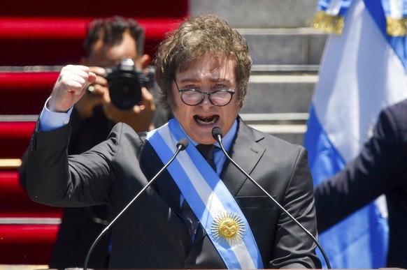 FILE - Argentina's newly sworn-in President Javier Milei speaks outside Congress in Buenos Aires, Argentina, December.  January 10, 2023. Milei has drastically cut spending to end the budget deficit and…