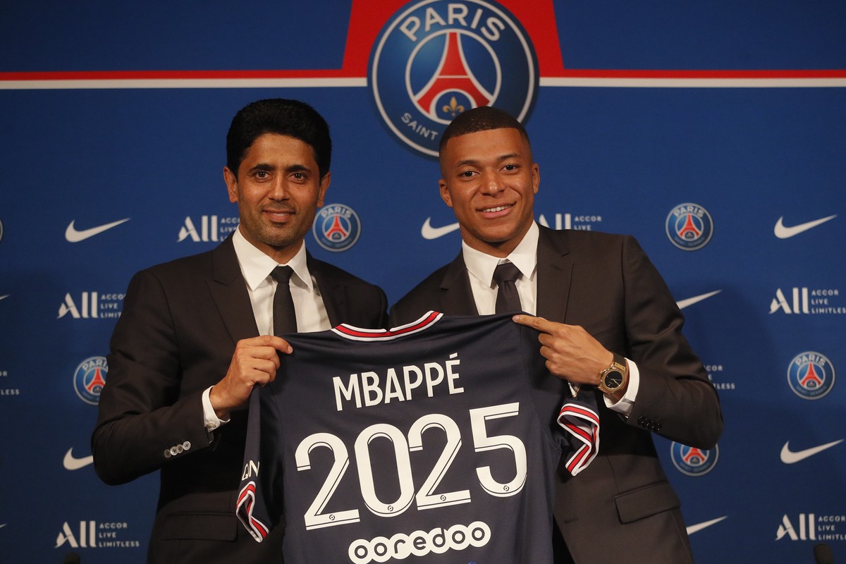 PSG striker Kylian Mbappe, right, shows his jersey with PSG president Nasser Al-Khelaifi during a press conference Monday, May 23, 2022 at the Paris des Princes stadium in Paris. Kylian Mbappé's ...
