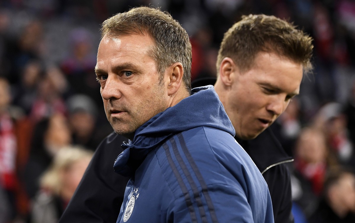 epa08206124 Bayern Munich's head coach Hansi Flick (front) and Leipzig's coach Julian Nagelsmann (back) before the German Bundesliga soccer match between FC Bayern Munich and RB Leipzig in M ...