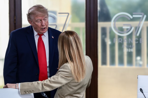 President Donald Trump speaks with Italian Prime Minister Giorgia Meloni at a working lunch with leaders of G7 and the Middle East in Evian-les-Bains, France, Tuesday, June 16, 2026. (Evelyn Hockstein ...