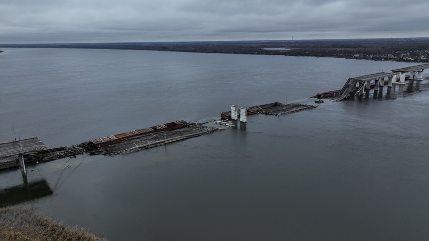 General view of the damaged Antonivsky Bridge in Kherson, Ukraine, Sunday, Nov. 27, 2022. The bridge, the main crossing point over the Dnipro river in Kherson, was destroyed by Russian troops in earli ...