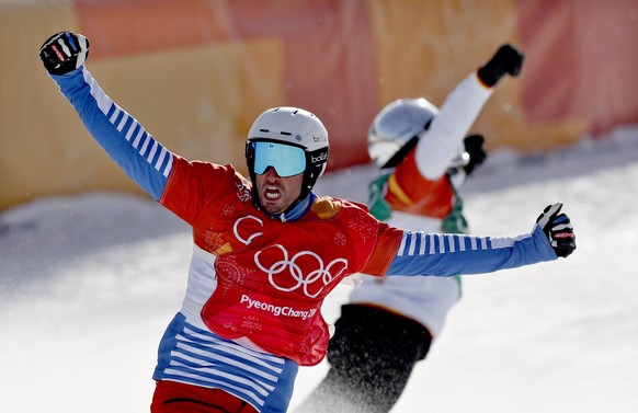 epa06527063 Pierre Vaultier (front) of France and Regino Hernandez of Spain celebrate after placing 1st and 3rd respectively in the Men&#039;s Snowboard Cross SBX final at the Bokwang Phoenix Park dur ...