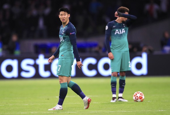 Tottenham&#039;s Son Heung-Min and Dele Alli, background, react after Ajax&#039;s Hakim Ziyech scored his side&#039;s second goal during the Champions League semifinal second leg soccer match between  ...