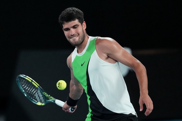 Carlos Alcaraz of Spain celebrates after defeating Alex de Minaur of Australia in their quarterfinal match at the Australian Open tennis championship in Melbourne, Australia, Tuesday, Jan. 27, 2026. ( ...