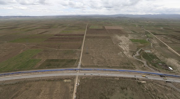 epa06594724 Aerial view of the flag unfolded in Patacamaya, Bolivia, 10 March 2018. Bolivia unfolded a 200 kms flag to break a world record and call the world&#039;s attention to the country&#039;s la ...