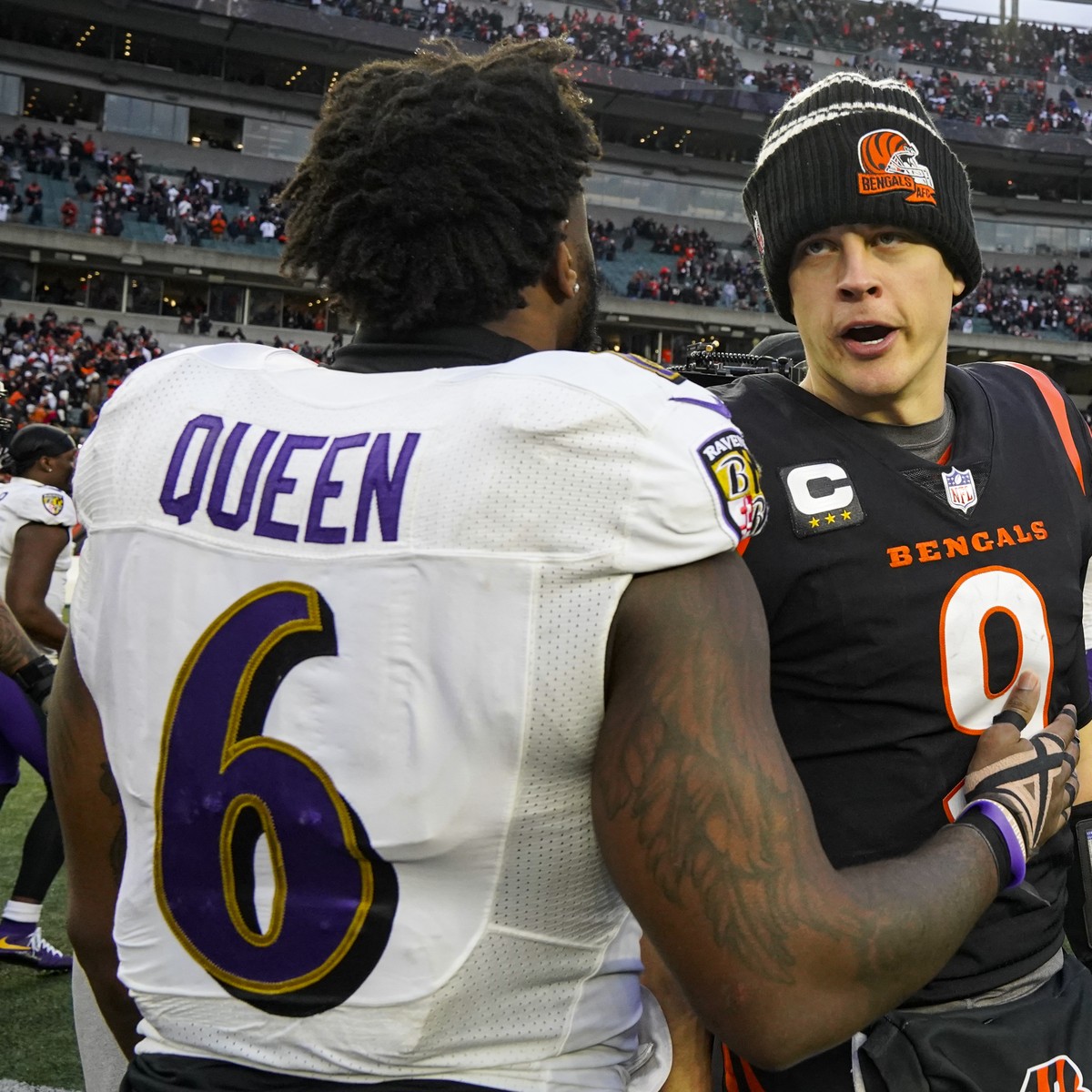 Cincinnati Bengals quarterback Joe Burrow (9) meets with Baltimore Ravens linebacker Patrick Queen (6) following an NFL football game against the Baltimore Ravens in Cincinnati, Sunday, Jan. 8, 2023.  ...