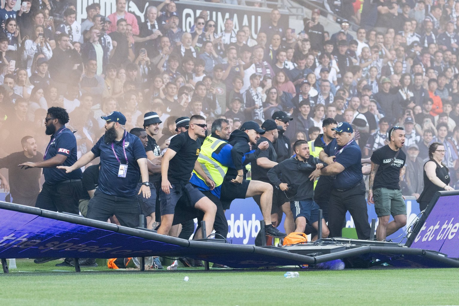 December 17, 2022: MELBOURNE, AUSTRALIA - DECEMBER 17: Fans invade the pitch resulting in a cancelled A-League Men s match between Melbourne City and Melbourne Victory at AAMI Park, on December 17, 20 ...