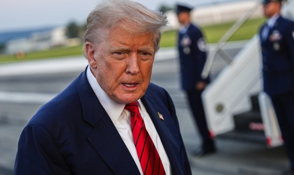 President Donald Trump speaks with reporters before boarding Air Force One at Lehigh Valley International Airport, Sunday, Aug. 3, 2025, in Allentown, Pa. (AP Photo/Julia Demaree Nikhinson)
Trump