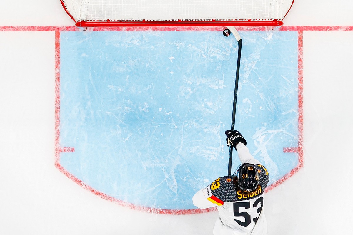 Germany's Moritz Seider clears the puck on the line during the Group A preliminary round game between Finland and Germany at the men's ice hockey world championship in Zurich, Switzerland, F ...