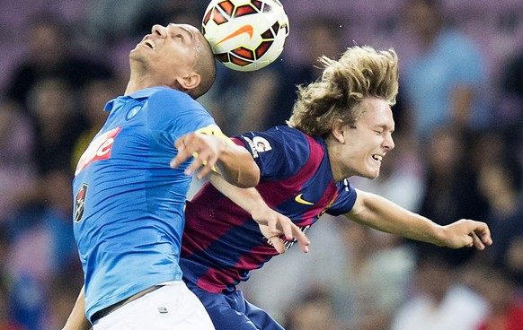 Napoli's Goekhan Inler of Switzerland, left, in action against FC Barcelona's Alen Halilovic, right, during a friendly soccer match between Spain's FC Barcelona and Italy's SSC Napoli at the Stade de  ...