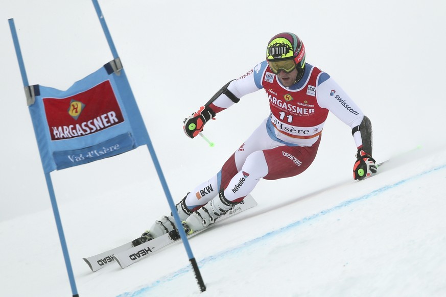 Switzerland&#039;s Justin Murisier during the first run of an alpine ski, men&#039;s World Cup giant slalom, in Val D&#039;Isere, France, Saturday, Dec. 11, 2021. (AP Photo/Gabriele Facciotti)