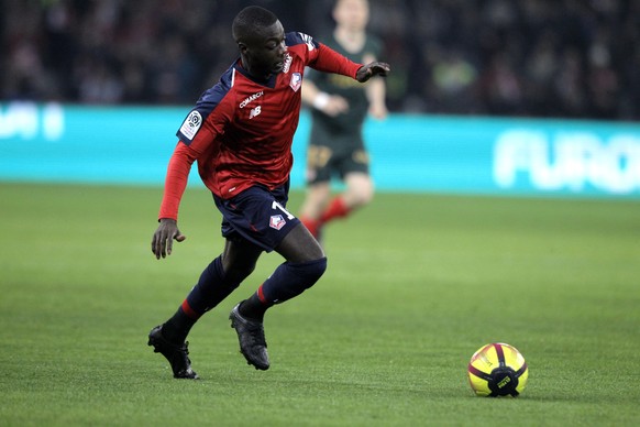 Lille's Nicolas Pepe controls the ball during the French League One soccer match between Lille and Monaco at the Lille Metropole stadium, in Villeneuve d'Ascq, northern France, Friday, March ...