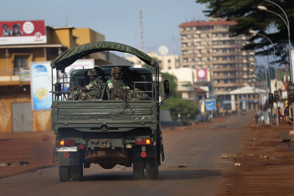 Burundi Misca troops patrol in the streets of Bangui Friday May 30, 2014. Bangui came to a standstill for the second day running as demonstrators set barricades to protest Wednesday's attack on a ...