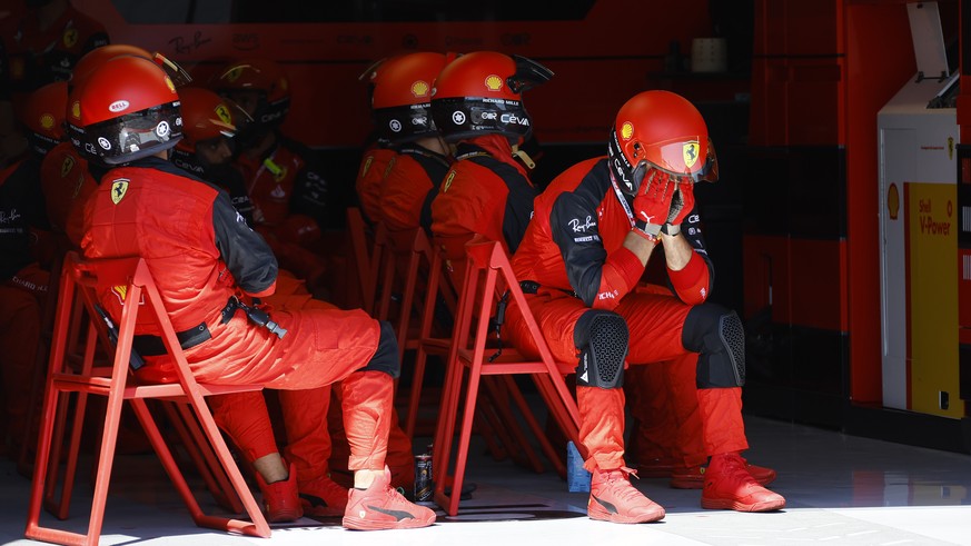 Ferrari mechanics react after Ferrari driver Charles Leclerc of Monaco crashed into the track wall during the French Formula One Grand Prix at Paul Ricard racetrack in Le Castellet, southern France, S ...