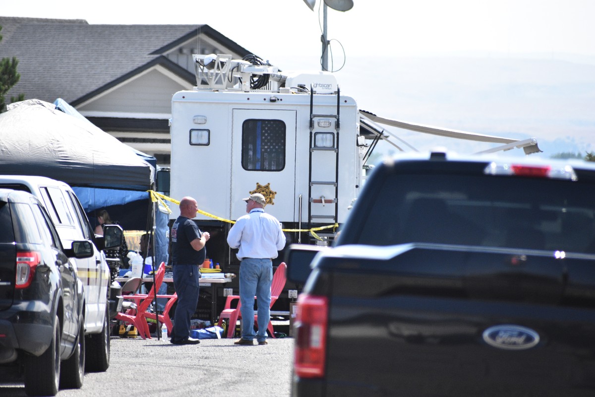 Investigators work at the scene Tuesday, Aug. 25, 2026, where a family was killed and a house burned in Billings, Mont. (AP Photo/Matthew Brown)
Montana Family Killed