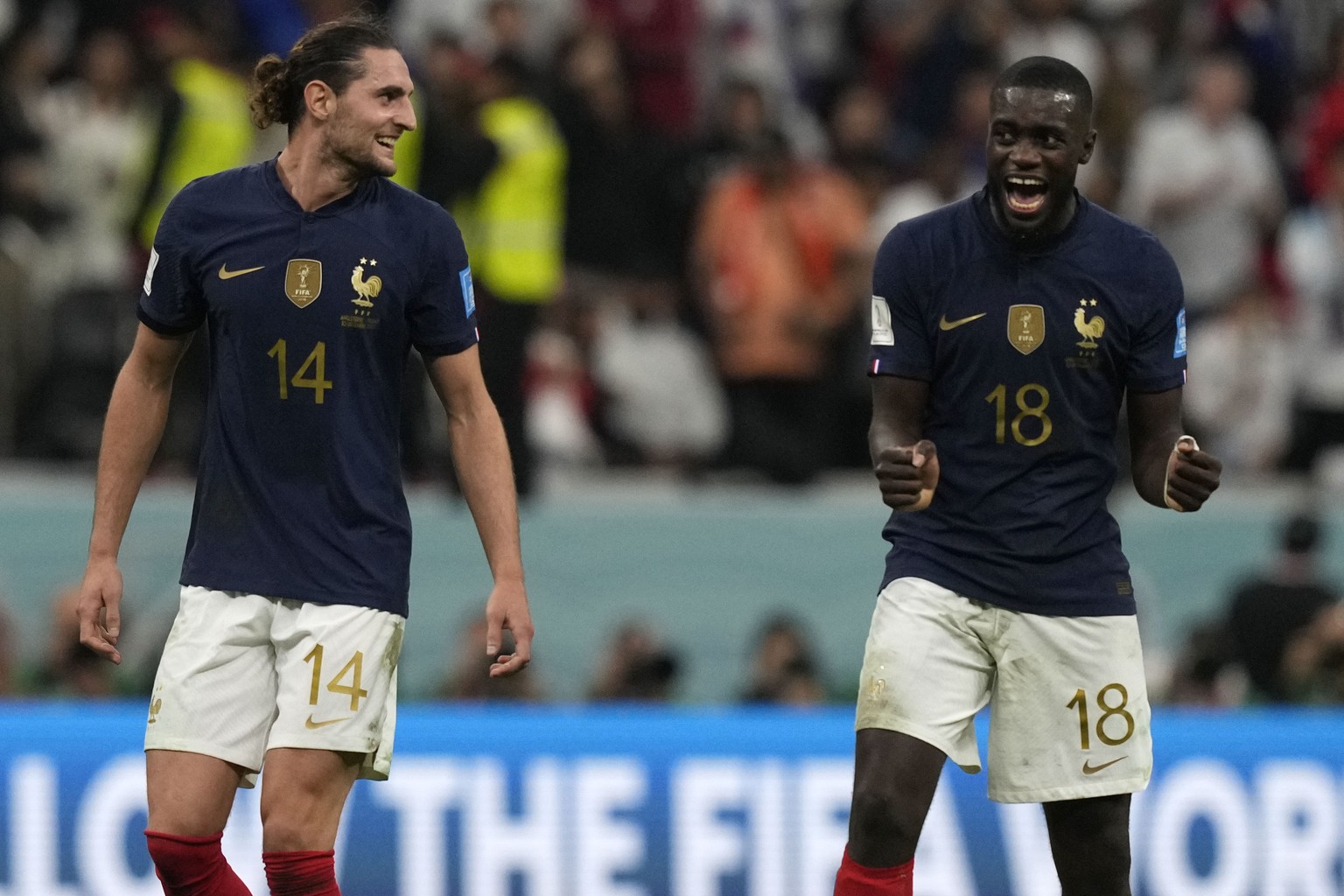 France&#039;s Adrien Rabiot, left, and France&#039;s Dayot Upamecano celebrate after the World Cup quarterfinal soccer match between England and France, at the Al Bayt Stadium in Al Khor, Qatar, Sunda ...