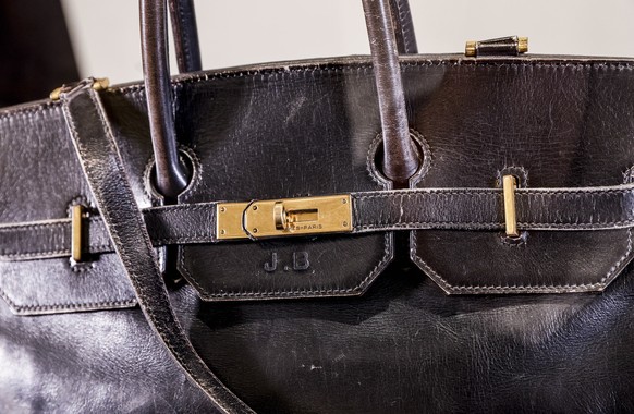 epa12210575 The original Birkin bag created by Hermes and owned by the English singer Jane Birkin on display during a Fashion Icons auction at Sotheby&#039;s press preview in Paris, France, 02 July 20 ...