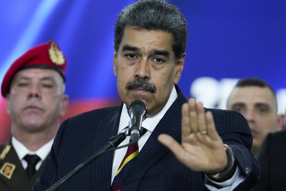 Venezuelan President Nicolas Maduro speaks to the press before leaving the Supreme Court where he arrived for procedures related to the court&#039;s audit of presidential election results in Caracas,  ...