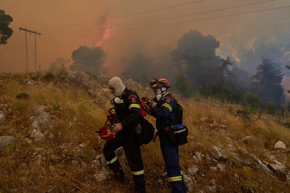 Firefighters operate on Mount Kithairon near Porto Germeno, northwest of Athens, Greece, Monday, Aug. 3, 2026. (AP Photo/Petros Giannakouris)
Greece Wildfires