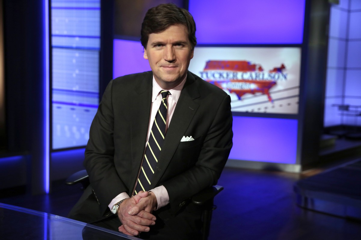 FILE - In this March 2, 20217, file photo, Tucker Carlson, host of "Tucker Carlson Tonight," poses for photos in a Fox News Channel studio in New York. A steady criticism of COVID vaccine ma ...