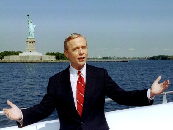 California Governor Pete Wilson poses for photographers in front of the Statue of Liberty August 28, after making a formal announcement as a Republican candidate for the presidential nomination. Wilso ...