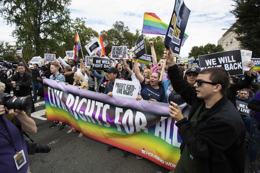 FILE - In this Oct. 8, 2019, photo, supporters of LGBTQ rights stage a protest on the street in front of the U.S. Supreme Court in Washington. A judge in Tennessee on Friday, July 15, 2022, has tempor ...