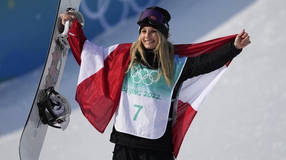 Gold medal winner Anna Gasser of Austria poses during a venue ceremony for the women's snowboard big air finals of the 2022 Winter Olympics, Tuesday, Feb. 15, 2022, in Beijing. (AP Photo/Jae C. Hong)