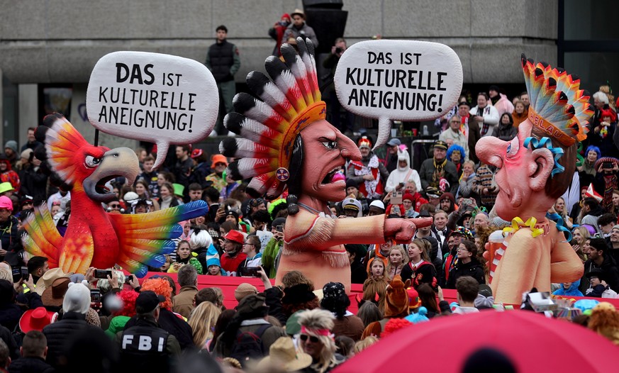 epa10480062 A carnival float about the concept of cultural appropriation parades during the annual Rose Monday (Rosenmontag) parade in Duesseldorf, Germany, 20 February 2023. Rose Monday is the tradit ...