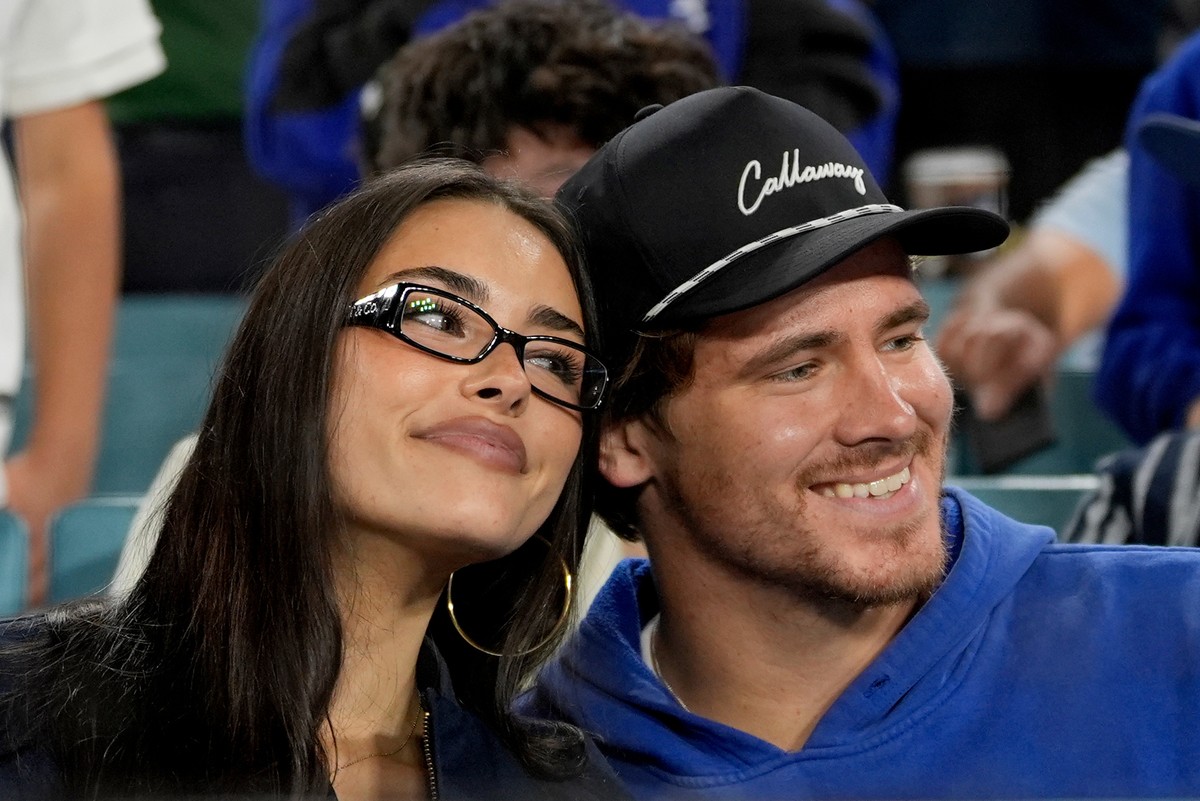 FILE - Los Angeles Chargers quarterback Justin Herbert and girlfriend Madison Beer watch the Toronto Blue Jays and the Los Angeles Dodgers compete during the seventh inning in Game 3 of baseball' ...