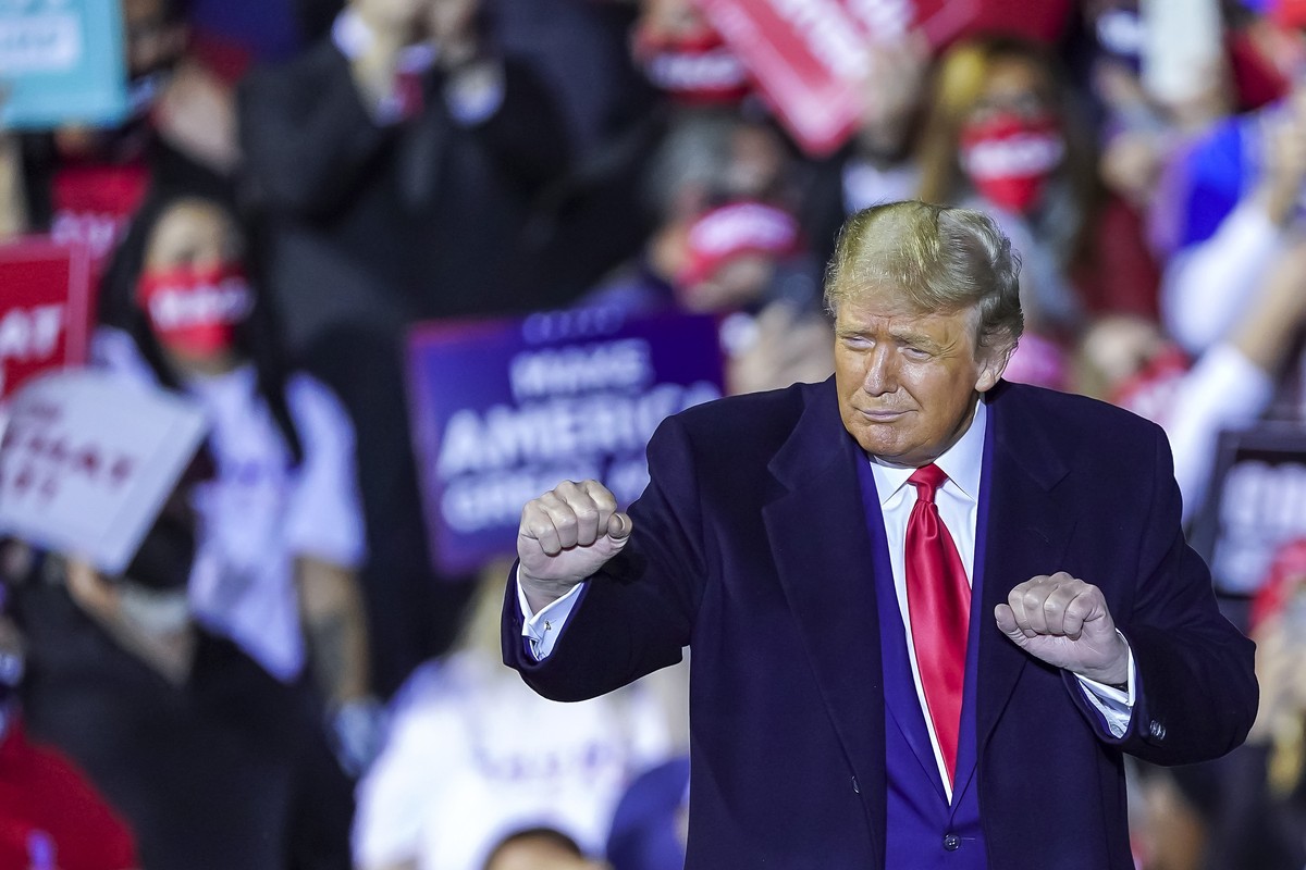 epa08687481 US President Donald J. Trump, gestures at the end of his 'Great American Comeback' campaign event at the Toledo Express Airport in Swanton, Ohio, USA, 21 September 2020. US Presi ...