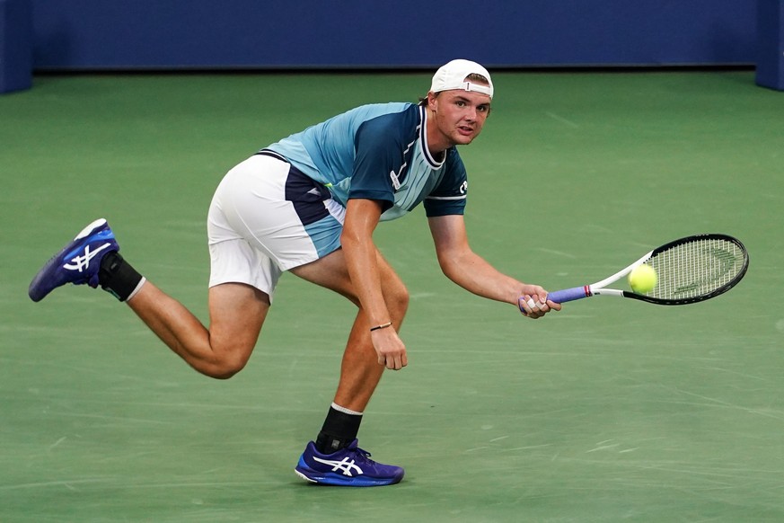 epa10838975 Dominic Stricker of Switzerland returns to Taylor Fritz of the USA during their fourth round match at the US Open Tennis Championships at the USTA National Tennis Center in Flushing Meadow ...