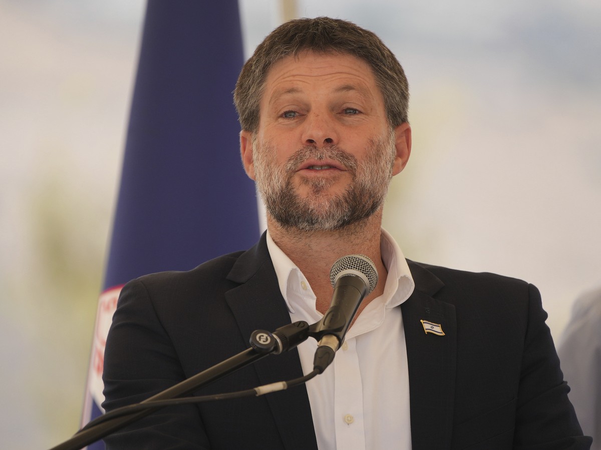 CORRECTS DAY Israeli Finance Minister Bezalel Smotrich speaks to journalists during a press conference about new settlement construction in the Israel-occupied West Bank near Maale Adumim, Thursday, A ...