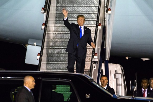 epa06798502 US President Donald J. Trump walks off Air Force One as he arrives at the Paya Lebar Air Base in Singapore, 10 June 2018. US President Donald J. Trump and North Korean leader Kim Jong-un a ...