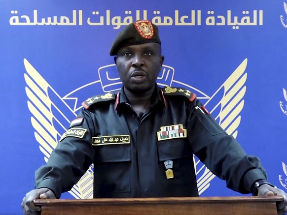 In this frame grab from a video posted by Sudan&#039;s state news agency, SUNA on Thursday, April 13, 2023, spokesman for the Sudanese Armed Forces Brig. Nabil Abdullah reads a statement warning of co ...