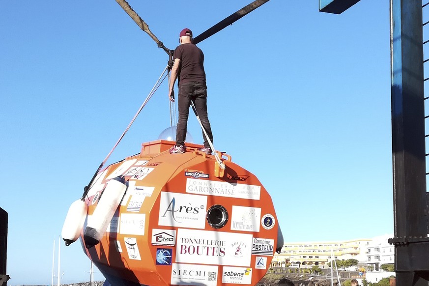 In this photograph taken Saturday Dec. 22, 2018, Frenchman Jean-Jacques Savin, 71-year-old, stands on top of his 3-metre (10-foot) long, 2.1-metre (7-foot) wide resin-coated plywood capsule, which wil ...