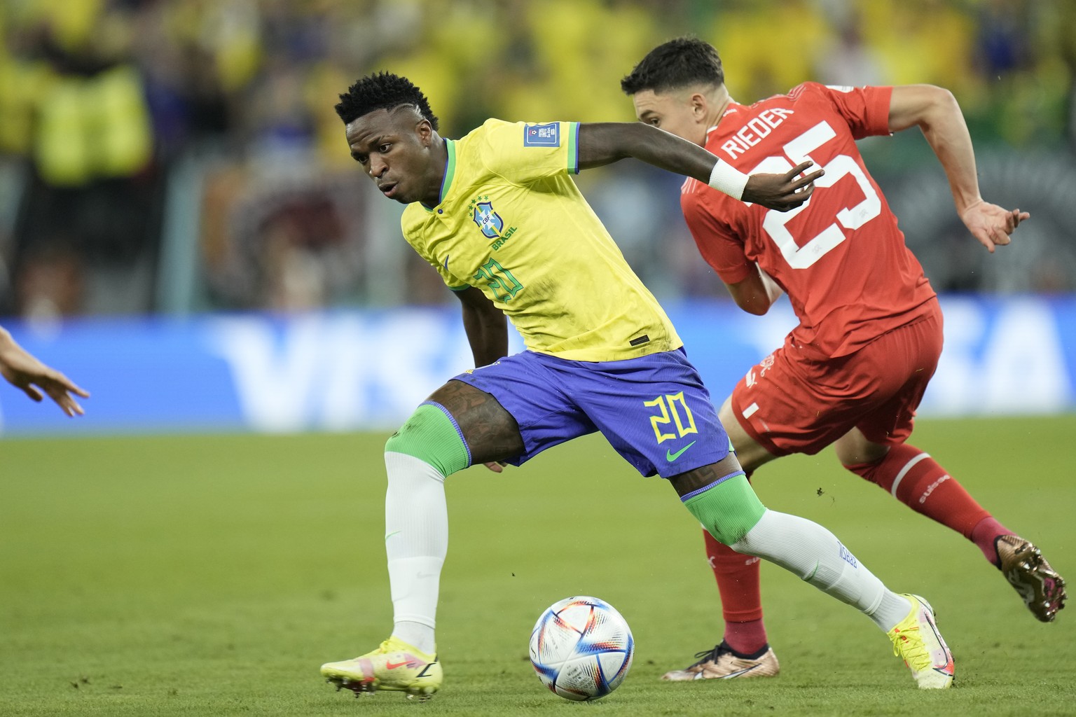 Brazil&#039;s Vinicius Junior, centre, and Switzerland&#039;s Fabian Rieder challenge for the ball during the World Cup group G soccer match between Brazil and Switzerland at the Stadium 974 in Doha,  ...