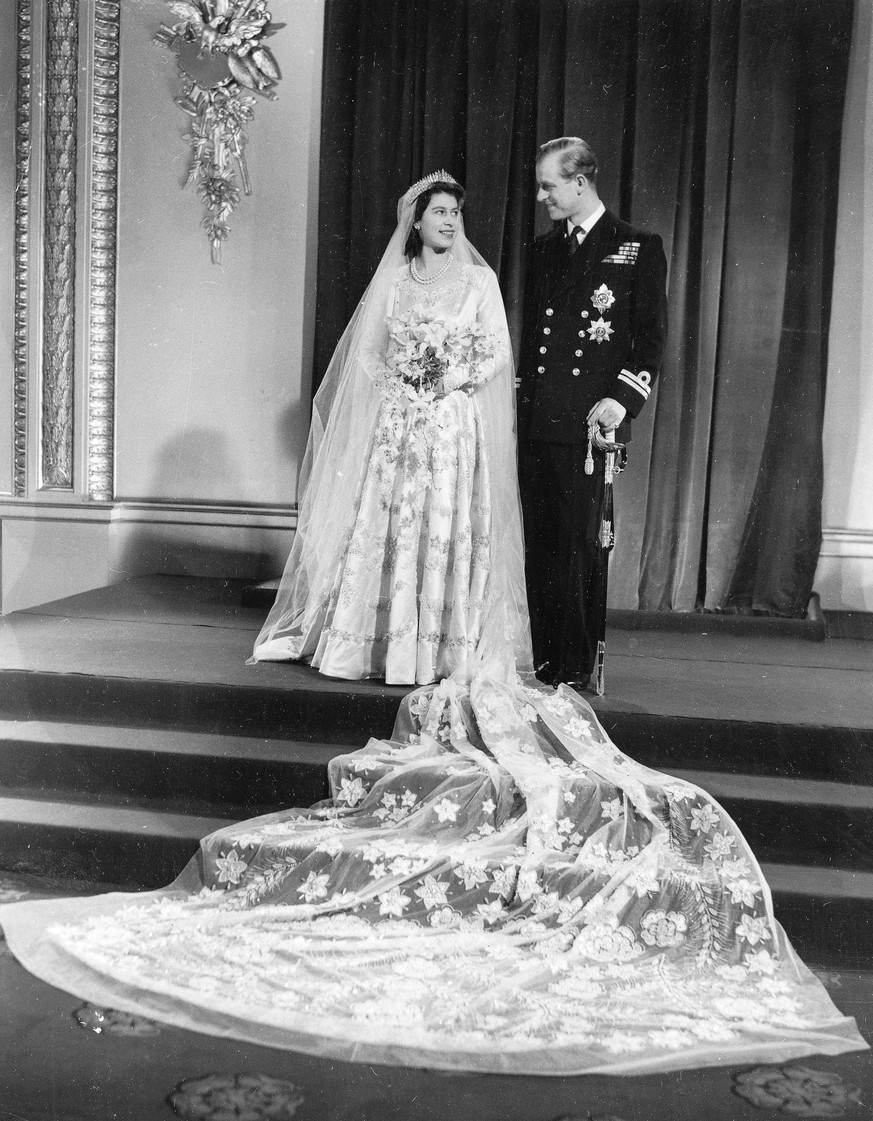 FILE - This Nov. 20, 1947 file photo, the official wedding picture of Princess Elizabeth and her new husband the Duke of Edinburgh, after their return to Buckingham Palace after their marriage in West ...