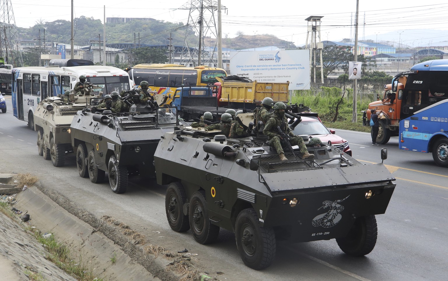 Armored vehicles exit the Deprivation of Liberty Center of the Zone 8 in Guayaquil, Ecuador, Saturday, Aug. 12, 2023. Military personnel entered the facility to transfer Adolfo Macias, alias ?Fito? co ...
