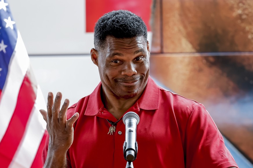 epa10212394 Georgia Republican US Senate candidate Herschel Walker participates in his Unite Georgia Bus Tour in Forsyth, Georgia, USA, 28 September 2022. Walker is running against incumbent Democrati ...