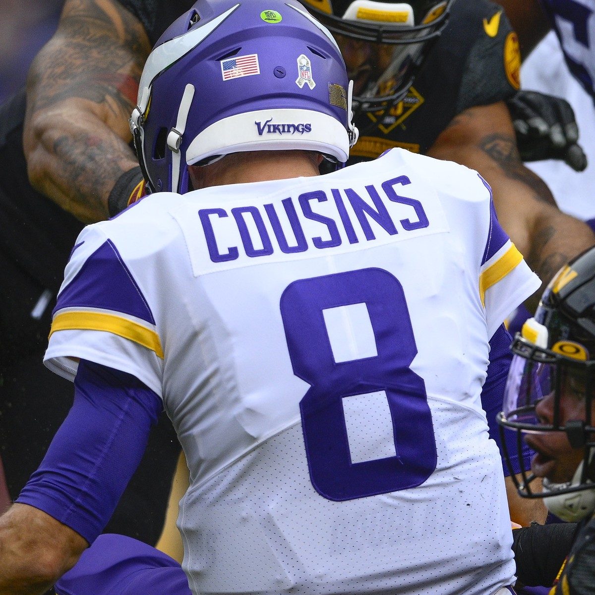 Minnesota Vikings quarterback Kirk Cousins (8) is sacked by Washington Commanders defensive tackle Daron Payne (94) during the first half of an NFL football game, Sunday, Nov. 6, 2022, in Landover, Md ...