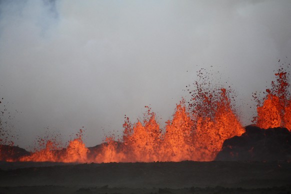 The lava flows on the the ground after the Bardabunga volcano erupted again on August 31, 2014. Scientists estimate the fissure to be at least 1.5 kilometres long. The lava is estimated to be six to e ...