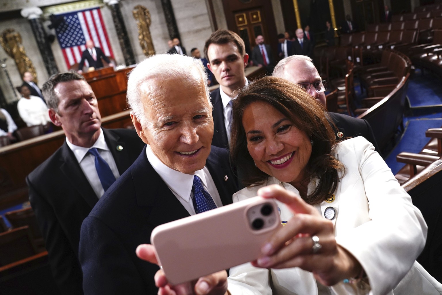 President Joe Biden, left, takes a photo with Rep. Veronica Escobar, D-Texas, after delivering the State of the Union address to a joint session of Congress at the Capitol, Thursday, March 7, 2024, in ...