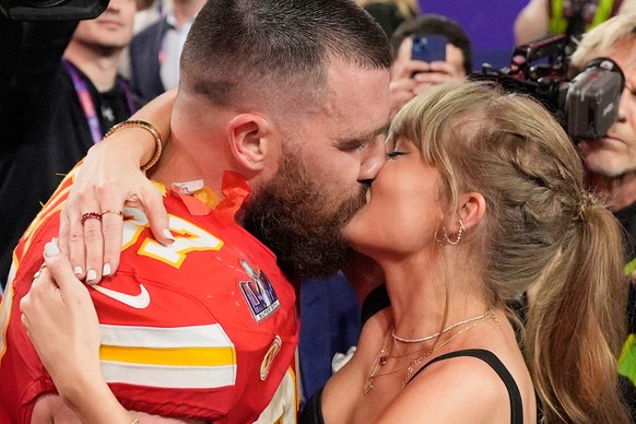 FILE - Kansas City Chiefs tight end Travis Kelce (87) and Taylor Swift kiss after the Chiefs defeated the San Francisco 49ers in the NFL Super Bowl 58 football game on Feb. 11, 2024, in Las Vegas. (AP ...