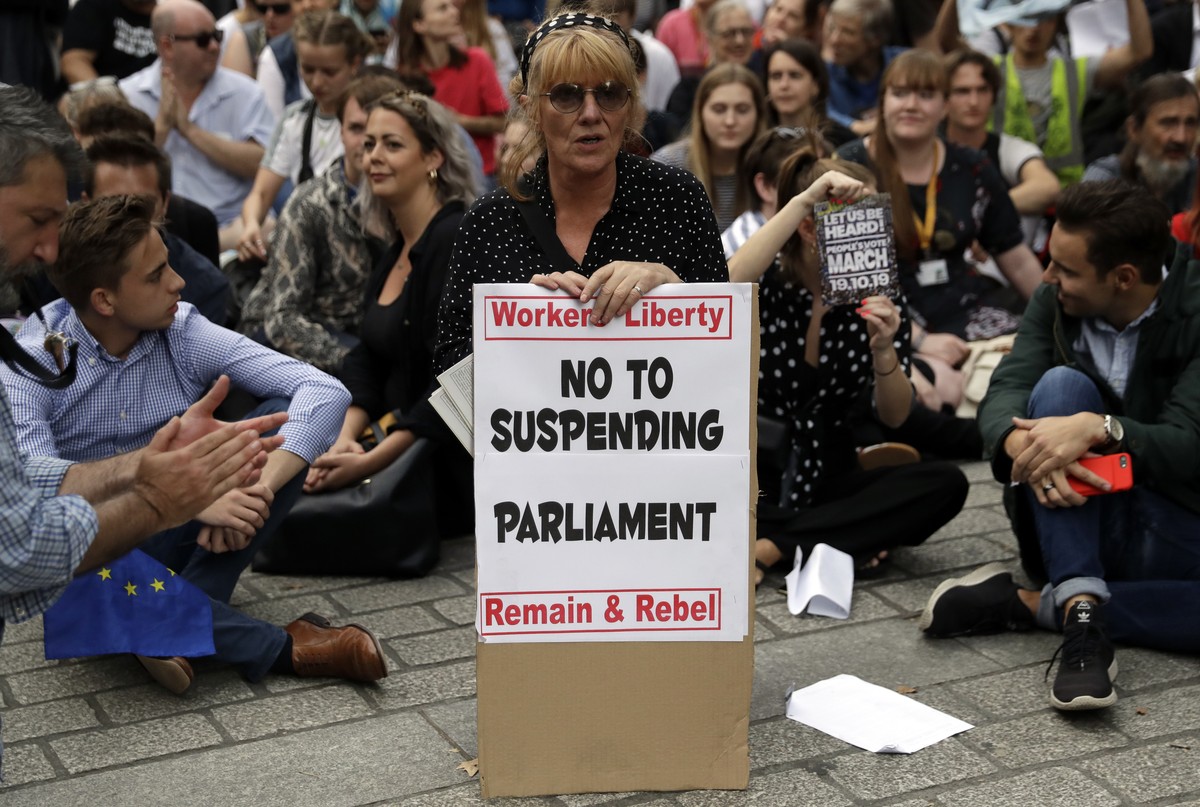 Anti-Brexit supporters gather outside the Prime Minister's residence 10 Downing Street in London, Wednesday, Aug. 28, 2019. British Prime Minister Boris Johnson asked Queen Elizabeth II on Wednes ...