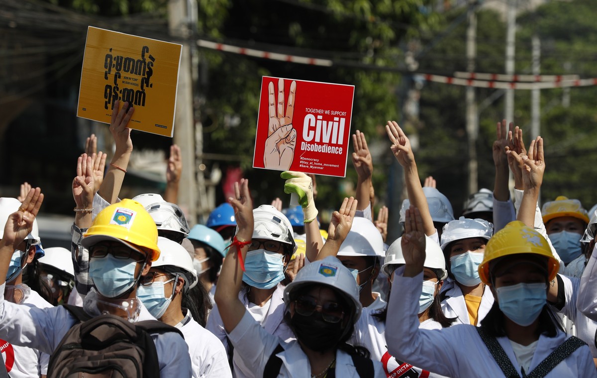 epa09053020 Demonstrators flash the three-finger salute during a protest against the military coup in Yangon, Myanmar, 05 March 2021. Anti-coup protests continued on 05 March despite the increasingly  ...
