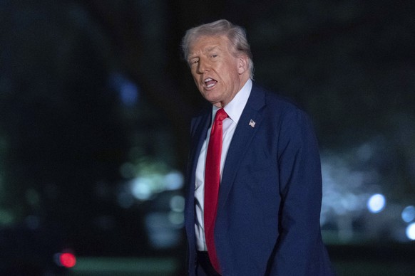 President Donald Trump talks to reporters as he walks on the South Lawn of the White House, in Washington, Sunday, March 30, 2025. (AP Photo/Jose Luis Magana)
Trump