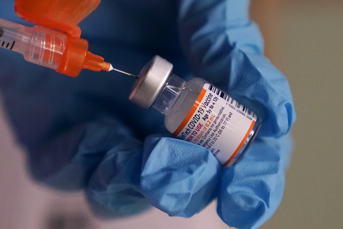 FILE - Pharmacist Sima Manifar prepares a children's dose of the Pfizer COVID-19 vaccine during a vaccination clinic at City of Lawrence's "The Center," which serves seniors, famil ...