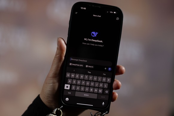 epa11859265 In this photo illustration, a person holds a phone showing the DeepSeek app in Los Angeles, California, USA, 28 January 2025. Stock of Nvidia plunged 17 percent, the worst daily percentage ...