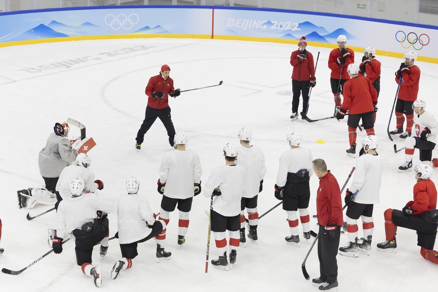 Patrick Fischer talks to his player during a training of the Switzerland national ice hockey team ahead of the preliminary group B games at the 2022 Winter Olympics in Beijing, China, on Saturday, Feb ...